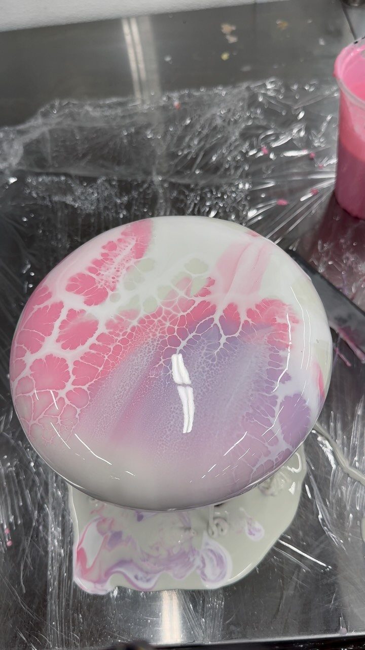 6 Inch Cake Decorating Ideas: 11 Flavors and Finishes to Try 12 Dome-shaped cake with a glossy pink, purple, and white marbled mirror glaze.