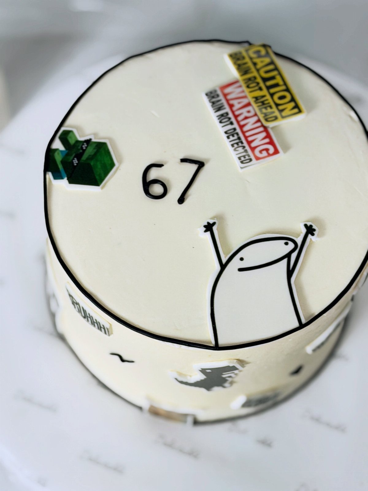 67 Cake Ideas for Birthdays: 14 Designs From Drip to Neon 15 White frosted cake with the number 67 and humorous brain rot warning signs.