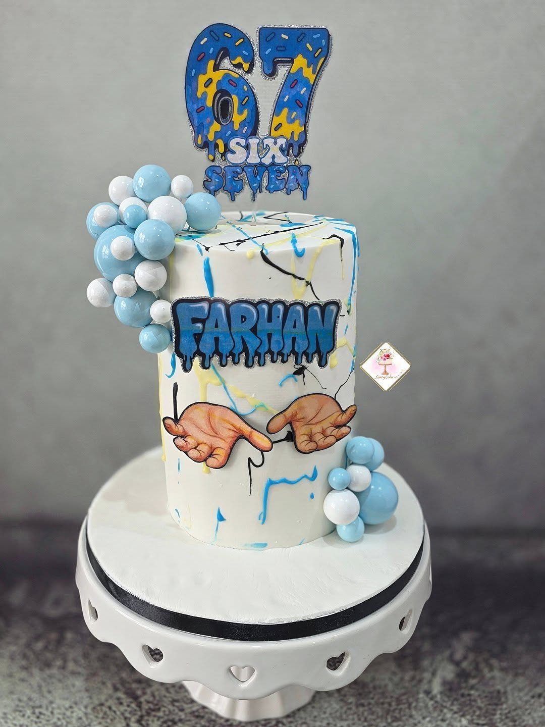 67 Cake Ideas for Birthdays: 14 Designs From Drip to Neon 3 White cake with blue paint drips, a 67 topper, and the name Farhan.