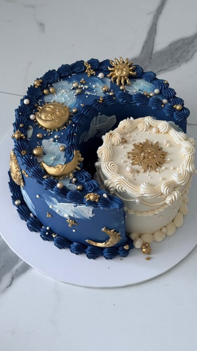 Blue crescent cake and cream circular cake decorated with gold celestial suns and moons.