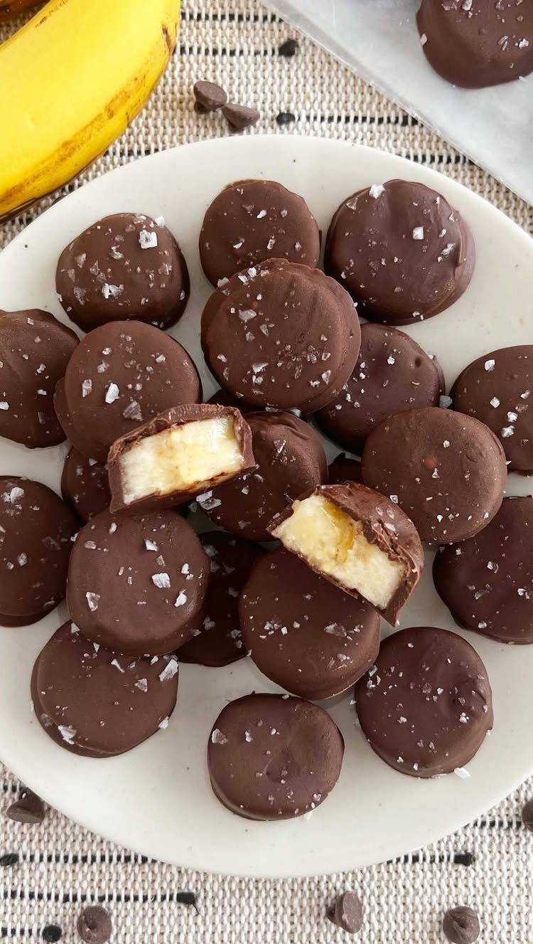 13 Birthday Party Treat Ideas, From Popcorn to Tea Sandwiches 7 Chocolate-covered banana slices with salt crystals on a white plate.