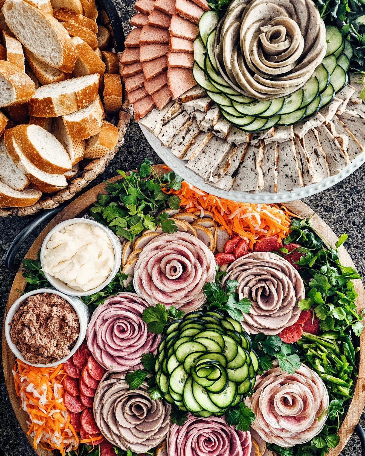 Charcuterie Board Table Ideas: 38 Grazing Tables and Platters 28 Banh mi board with meat roses, sliced cucumbers, pickled carrots, and baguette slices.