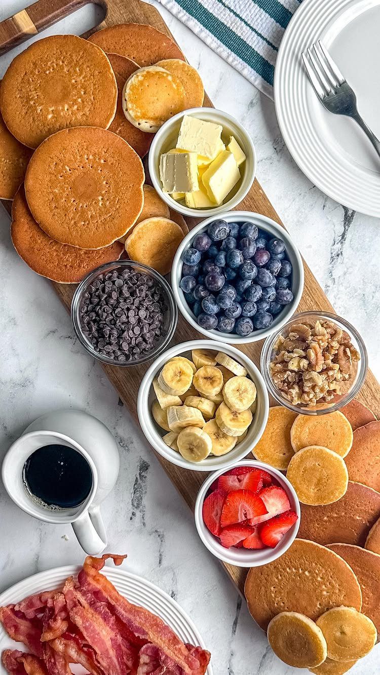 Charcuterie Board Table Ideas: 38 Grazing Tables and Platters 35 Breakfast charcuterie board with pancakes, fresh berries, bananas, nuts, and crispy bacon.