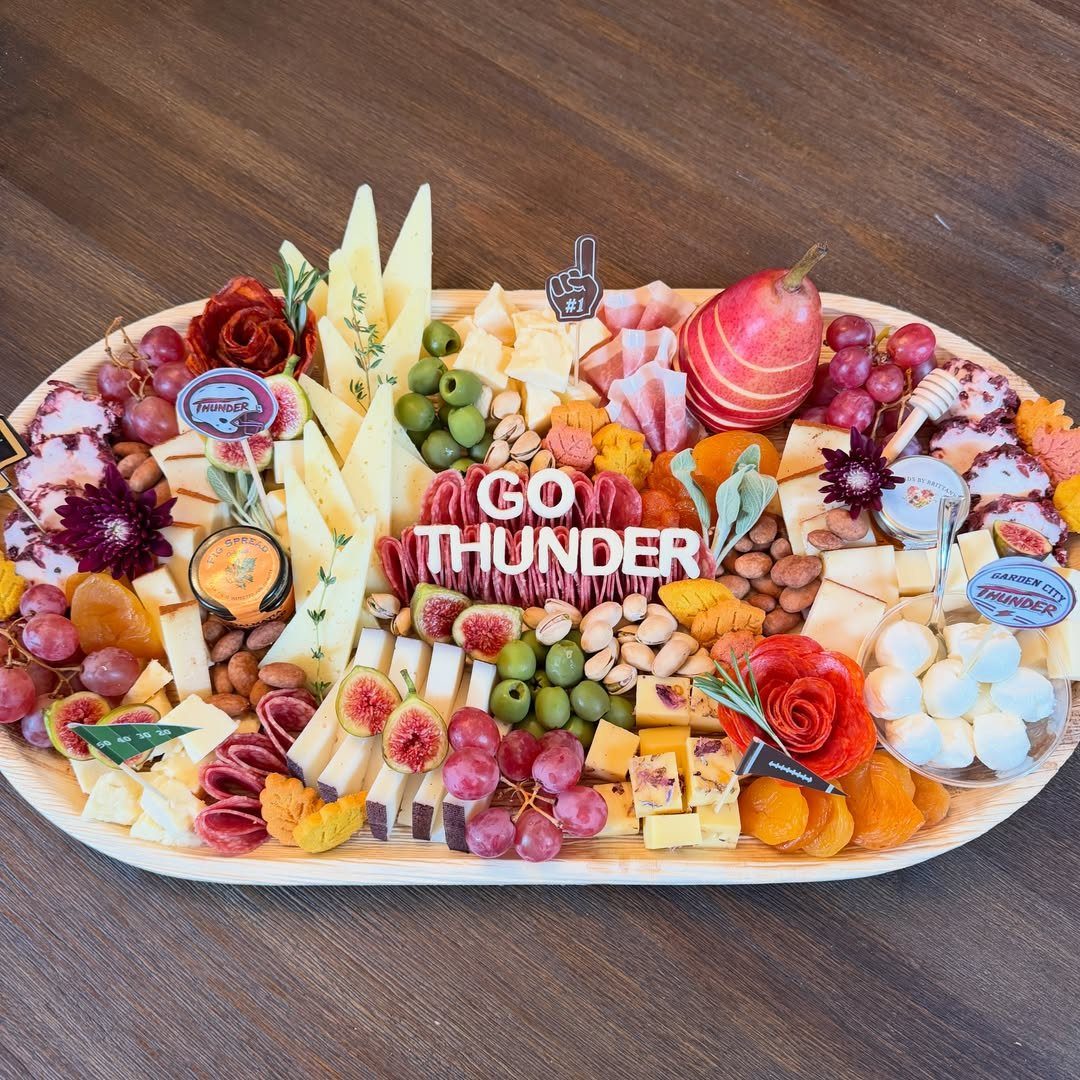 Charcuterie Board Table Ideas: 38 Grazing Tables and Platters 13 Charcuterie board with meats, cheeses, and fruits featuring Go Thunder sports team branding.