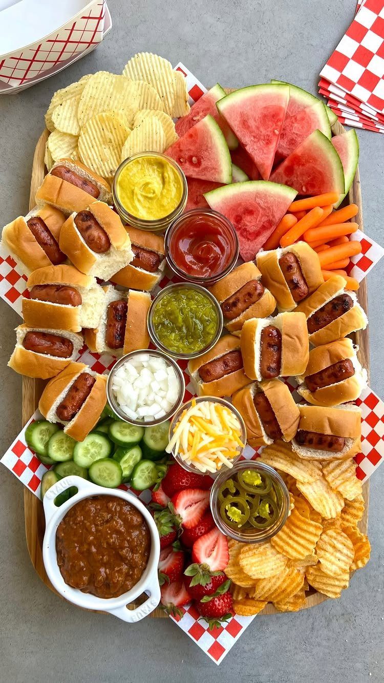 Charcuterie Board Table Ideas: 38 Grazing Tables and Platters 21 Mini hot dog board with potato chips, fresh fruit, vegetables, and dipping sauces.