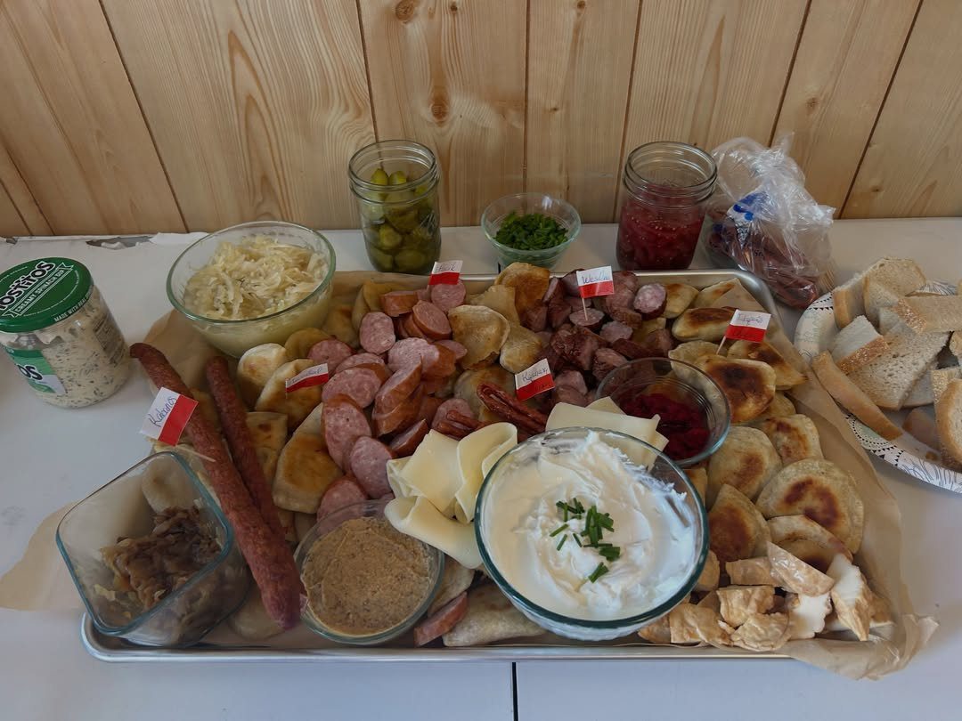 Charcuterie Board Table Ideas: 38 Grazing Tables and Platters 26 Kielbasa and pierogi board with cheese, dips, and pickles on a metal tray.