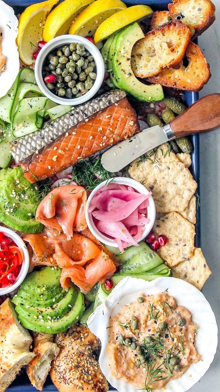 Charcuterie Board Table Ideas: 38 Grazing Tables and Platters 24 Smoked salmon platter with avocado, cucumber, capers, and toasted bread on a tray.