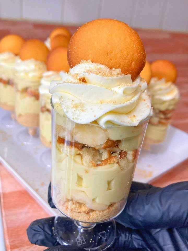 27 Easy Sweet Treats No Bake Ideas, From Fudge to Eton Mess 4 Banana pudding parfait with layers of cream, bananas, and wafers in a glass.
