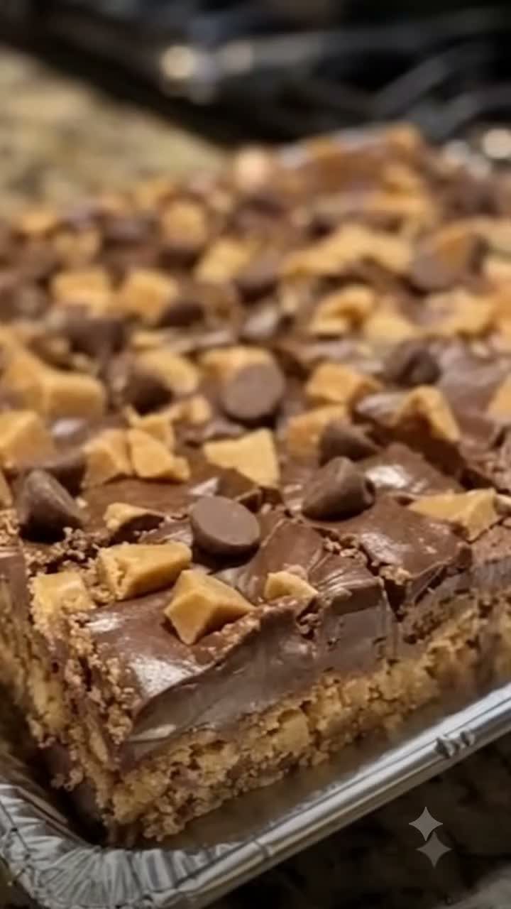 27 Easy Sweet Treats No Bake Ideas, From Fudge to Eton Mess 2 Layered chocolate peanut butter bars with chocolate chips and peanut butter chunks in foil pan