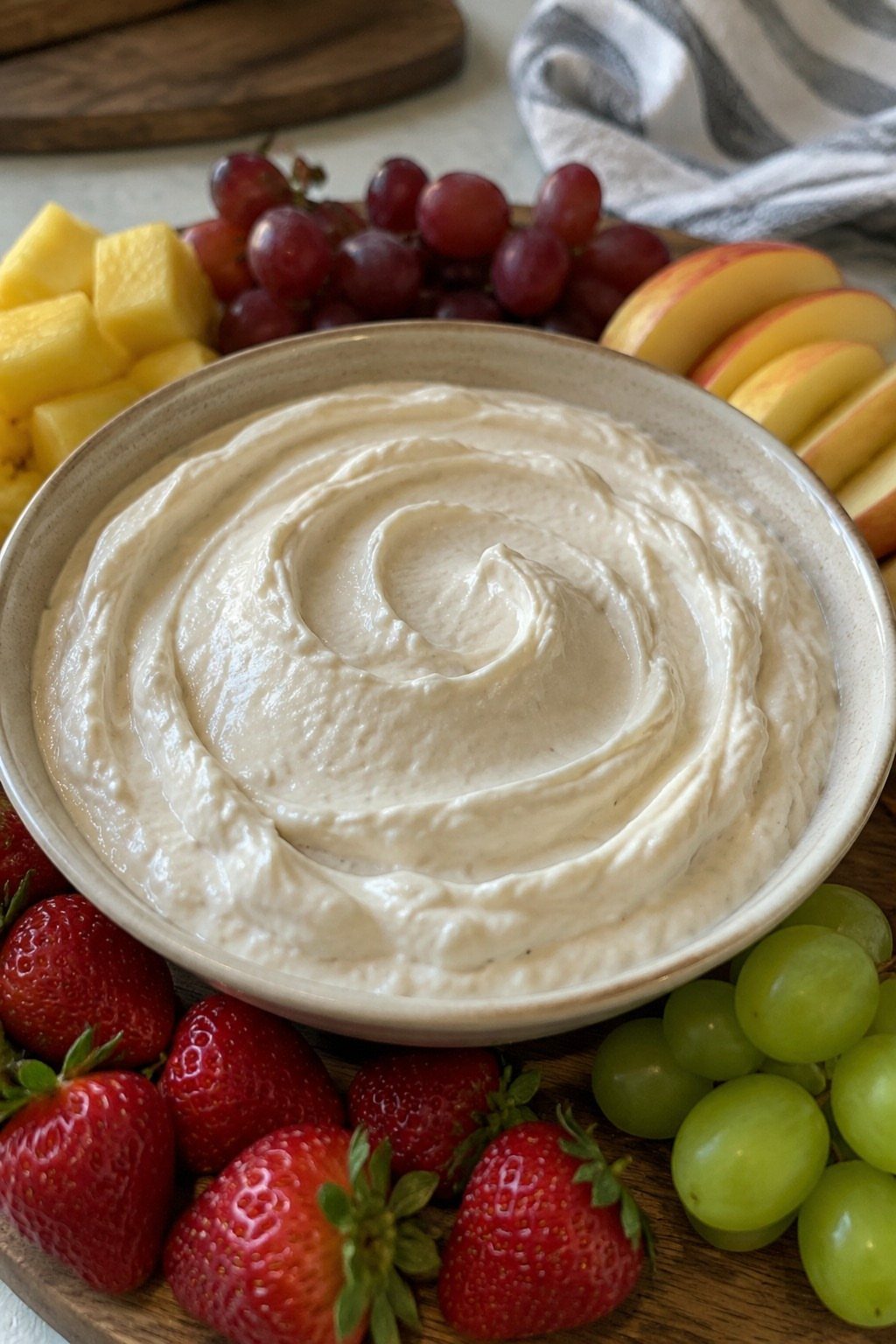 27 Easy Sweet Treats No Bake Ideas, From Fudge to Eton Mess 14 Creamy white cheesecake dip in a bowl surrounded by fresh assorted fruits.