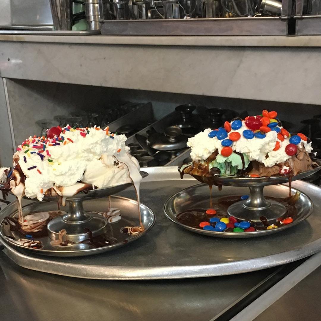 27 Easy Sweet Treats No Bake Ideas, From Fudge to Eton Mess 19 Two ice cream sundaes with whipped cream, chocolate syrup, and colorful toppings in metal bowls.