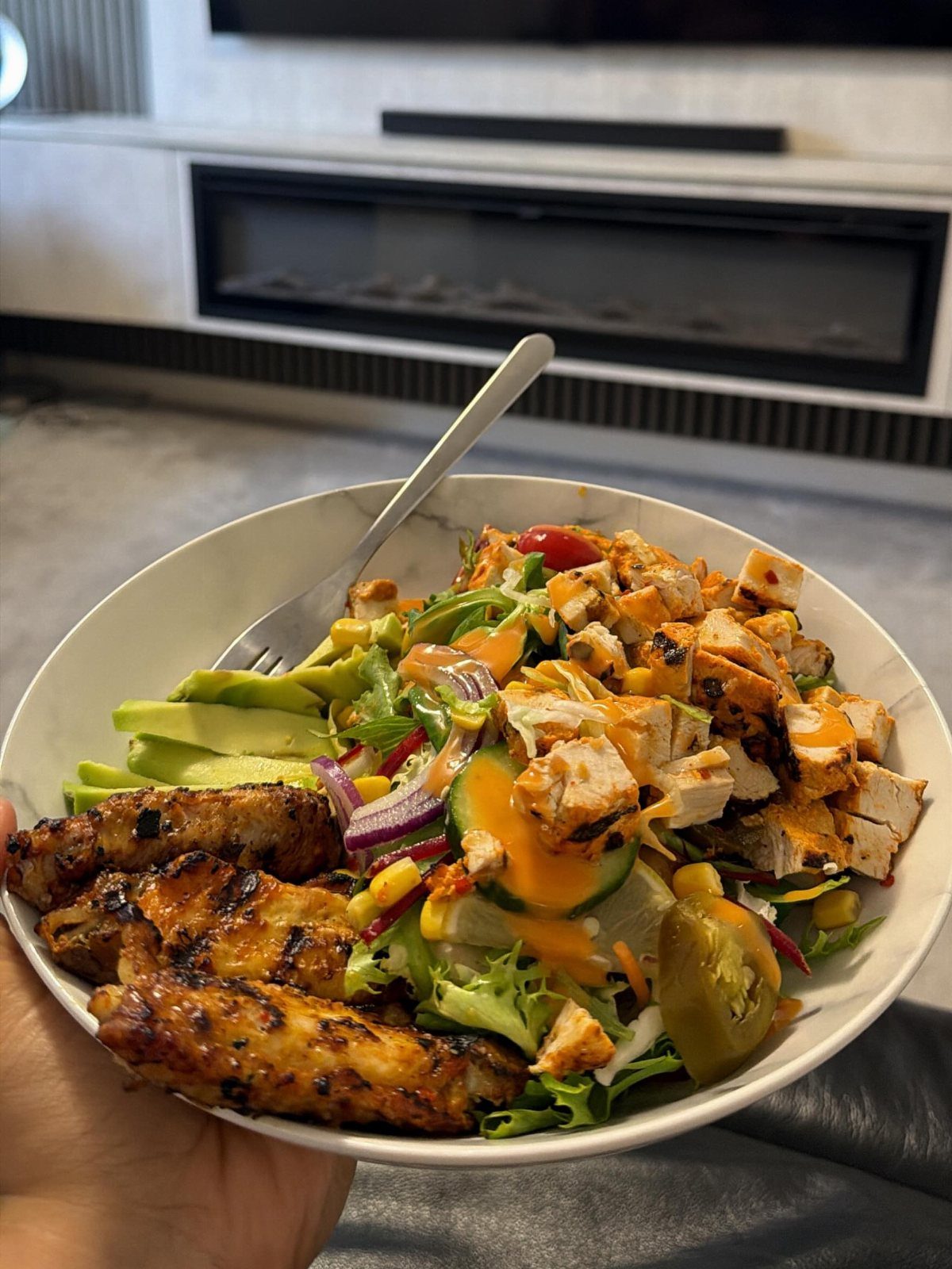 40 Food Lunch Recipes You Can Make in Minutes 20 Grilled chicken salad with avocado, corn, and cucumber in a white bowl