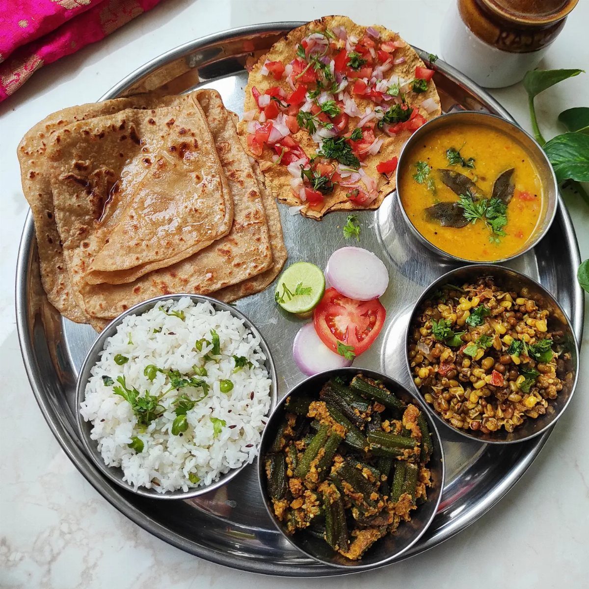 40 Food Lunch Recipes You Can Make in Minutes 36 Indian thali platter with rice, dal, okra, vegetable curry, flatbreads, and fresh salad.