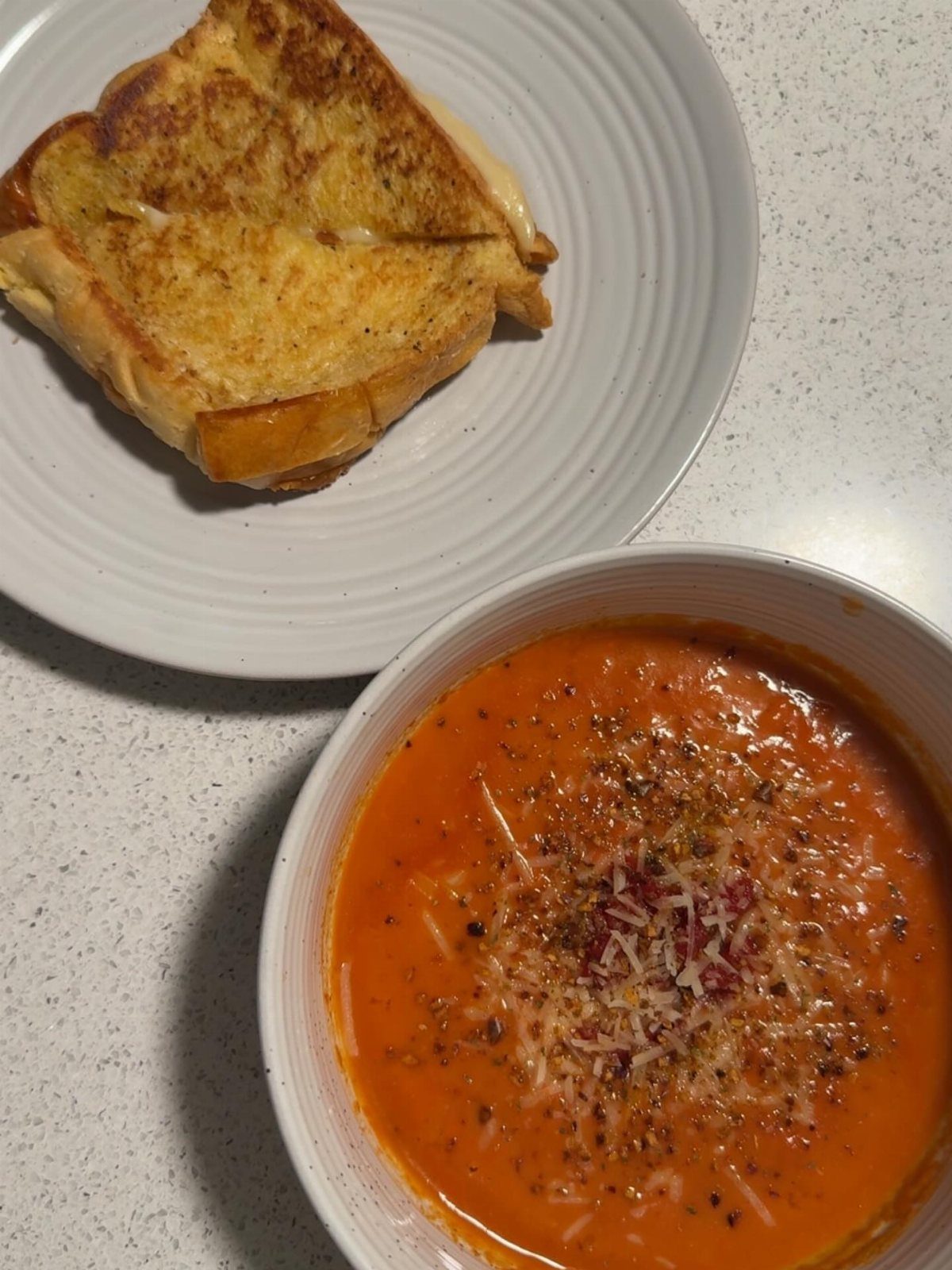 40 Food Lunch Recipes You Can Make in Minutes 6 Tomato soup with cheese and pepper served with a toasted grilled cheese sandwich.