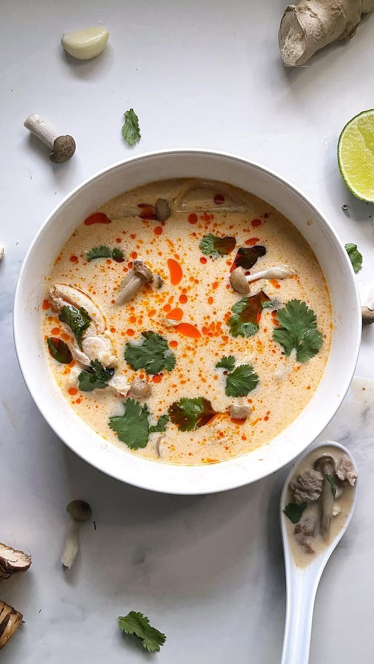 40 Food Lunch Recipes You Can Make in Minutes 5 Creamy Thai hot sour soup with mushrooms and cilantro in a white bowl.