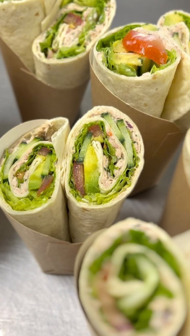 40 Food Lunch Recipes You Can Make in Minutes 10 Tortilla wraps filled with fresh vegetables and creamy salad in brown paper sleeves.