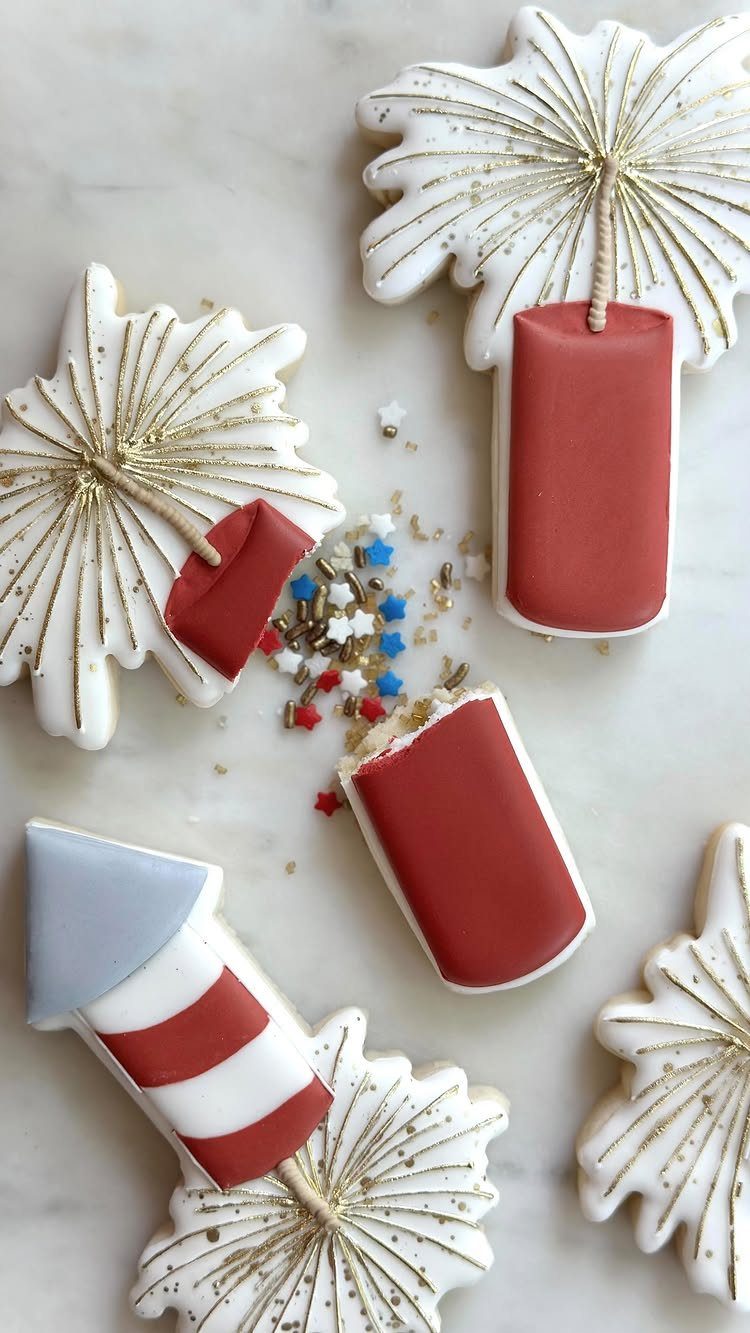 Fun Shaped Cookies: 35 Cut-Out Cookie Recipes to Decorate 17 Fireworks celebration cookies shaped like red firecrackers and white bursts with gold glitter.