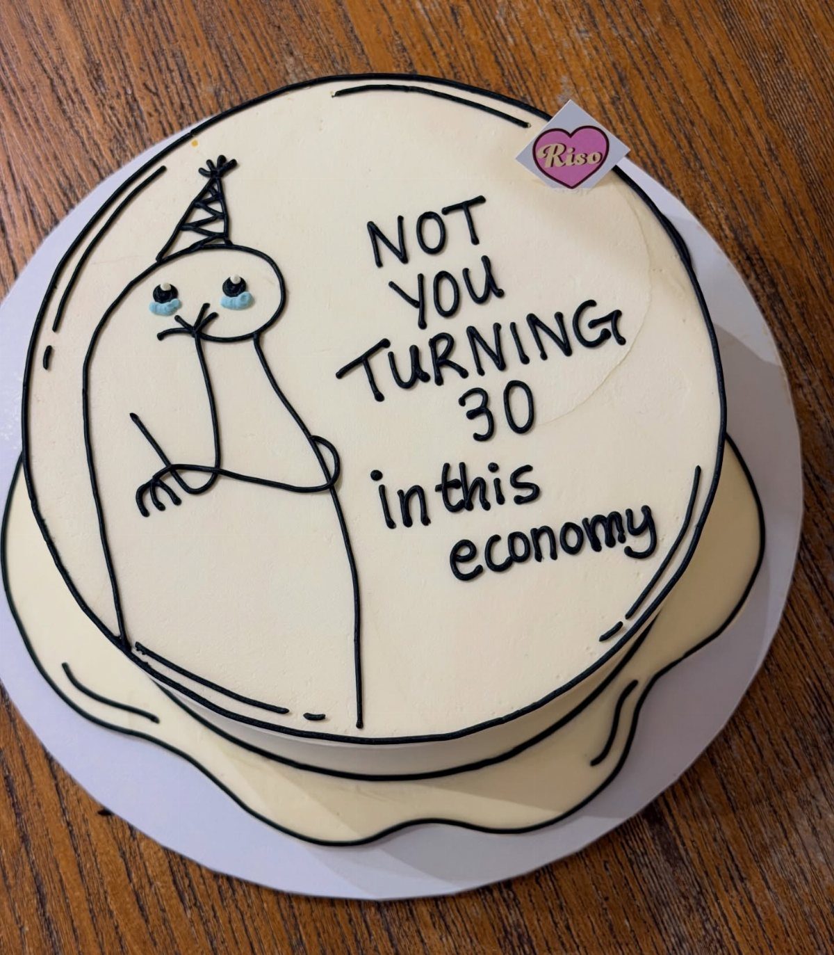 24 Funny Cakes Ideas for Birthdays, From Pizza to Poop Emoji 20 White cake with a sad character drawing and funny text about turning thirty.