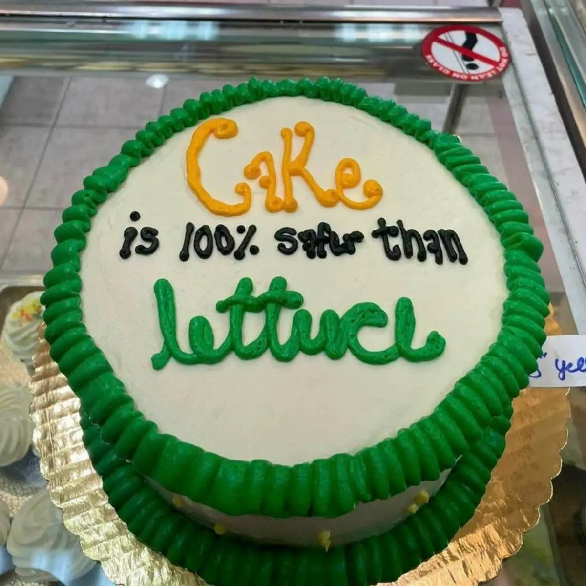 24 Funny Cakes Ideas for Birthdays, From Pizza to Poop Emoji 24 White frosted cake with green borders and funny text about lettuce on gold base