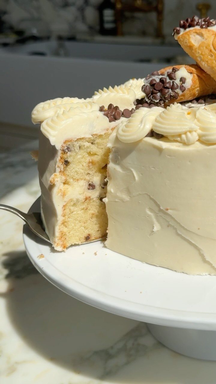24 Funny Cakes Ideas for Birthdays, From Pizza to Poop Emoji 2 White frosted layer cake topped with cream, chocolate chips, and cannoli shells.