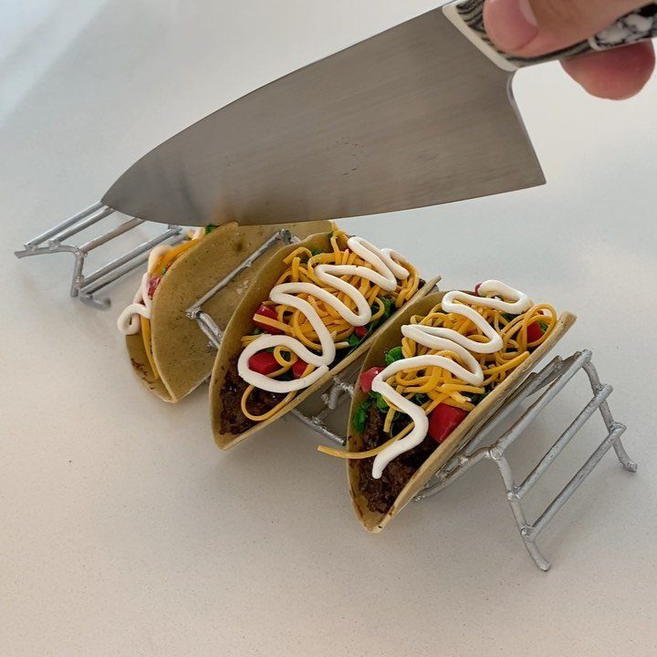 24 Funny Cakes Ideas for Birthdays, From Pizza to Poop Emoji 18 Taco-shaped cake with realistic toppings being sliced by a large metal knife