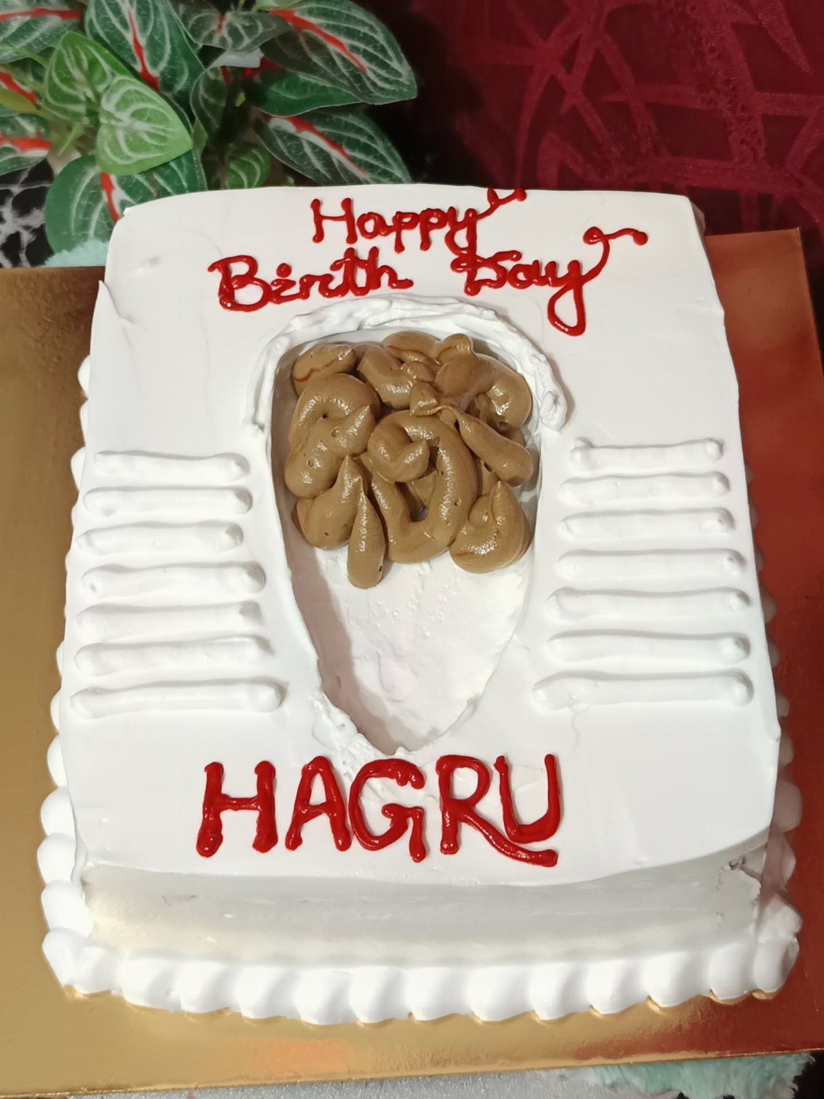 24 Funny Cakes Ideas for Birthdays, From Pizza to Poop Emoji 9 Toilet shaped cake with brown frosting feces and red icing birthday text.
