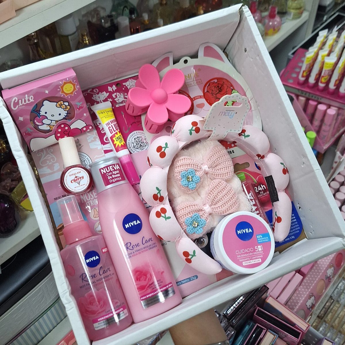 38 Gift Ideas for 13th Birthday in 2026, From Snoopy to LEGO 31 Pink themed gift basket with skincare products, a cherry headband, and cute accessories.
