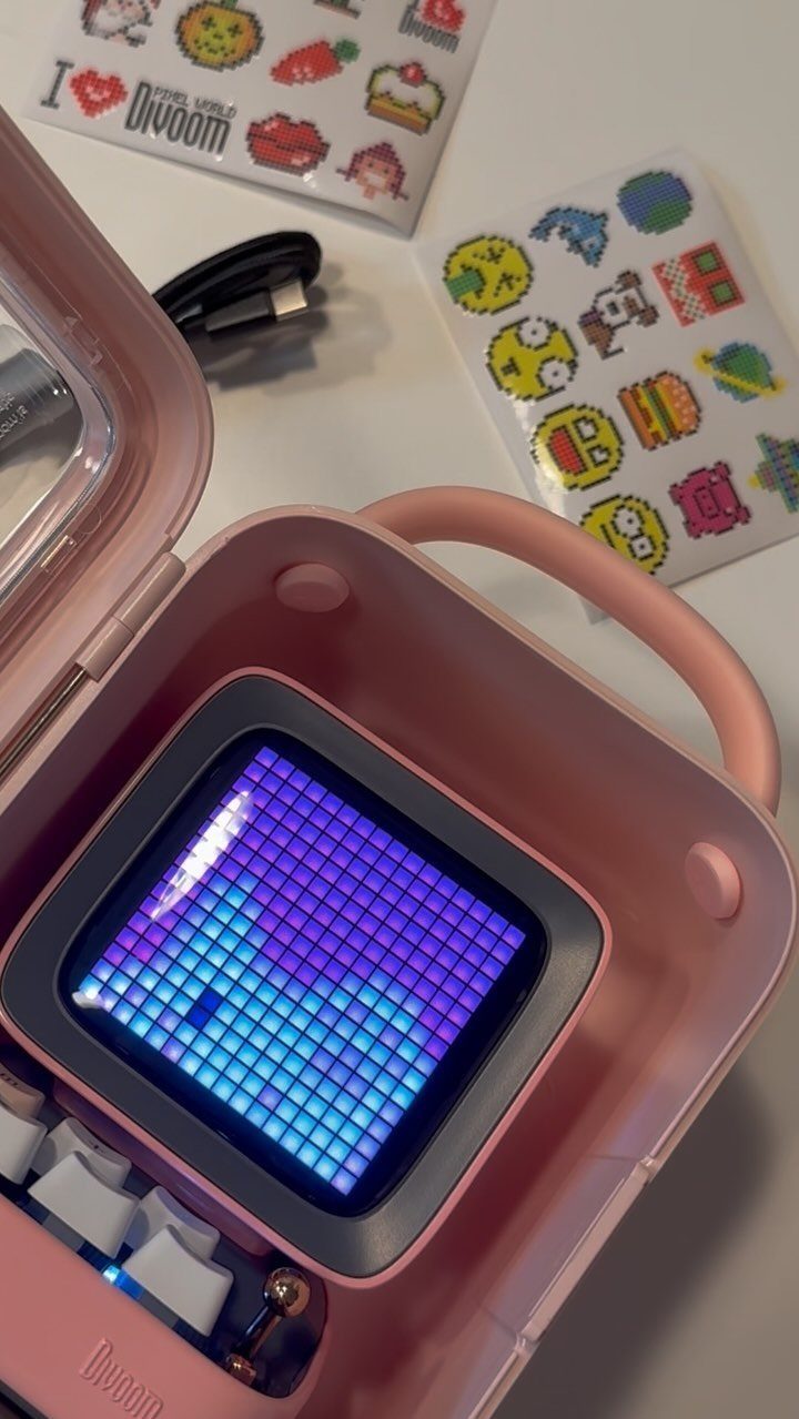 38 Gift Ideas for 13th Birthday in 2026, From Snoopy to LEGO 26 Pink Divoom pixel art speaker with glowing screen and colorful sticker sheets.