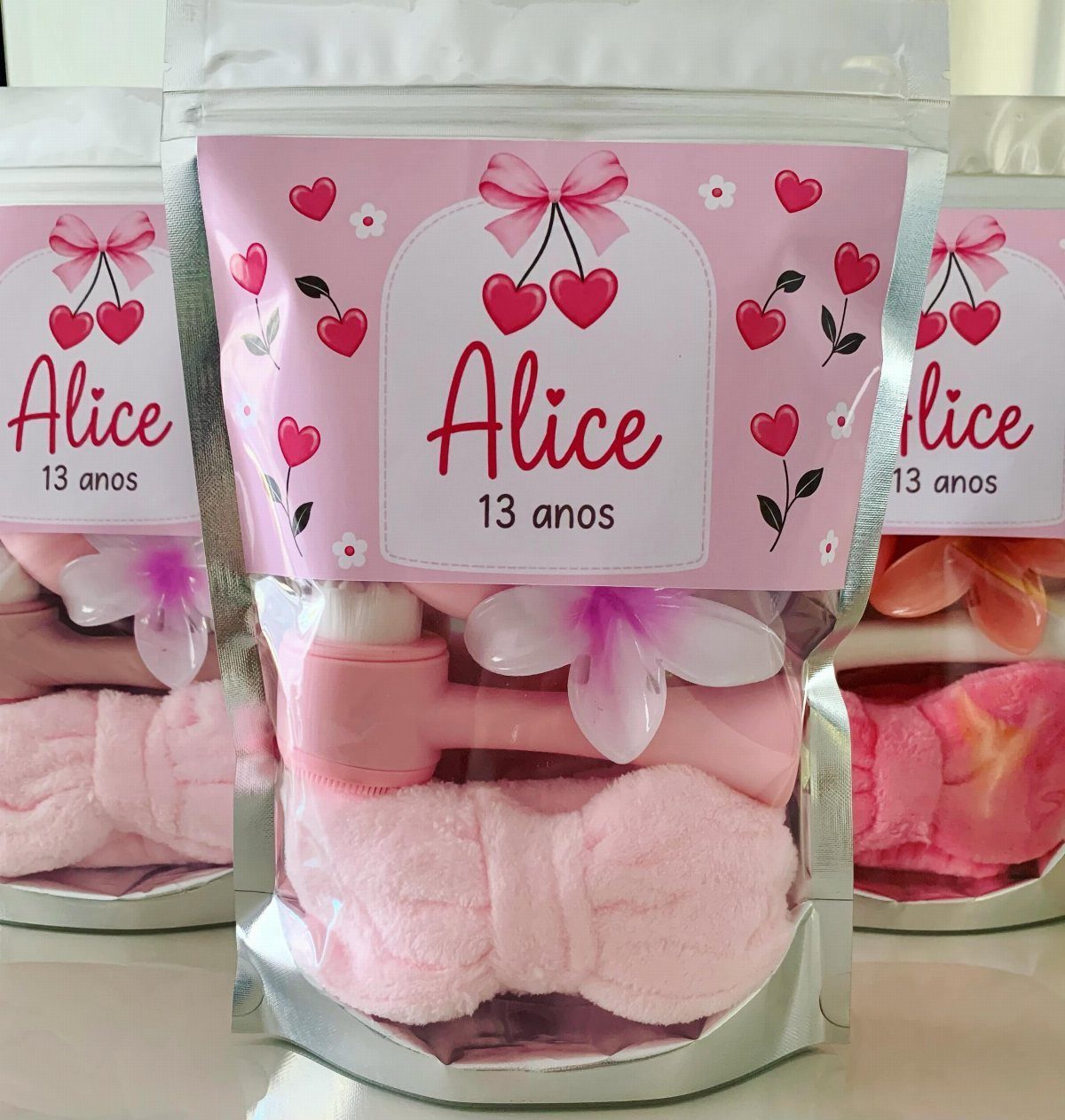 38 Gift Ideas for 13th Birthday in 2026, From Snoopy to LEGO 29 Pink skincare gift bags for a 13th birthday containing a facial roller and headband.