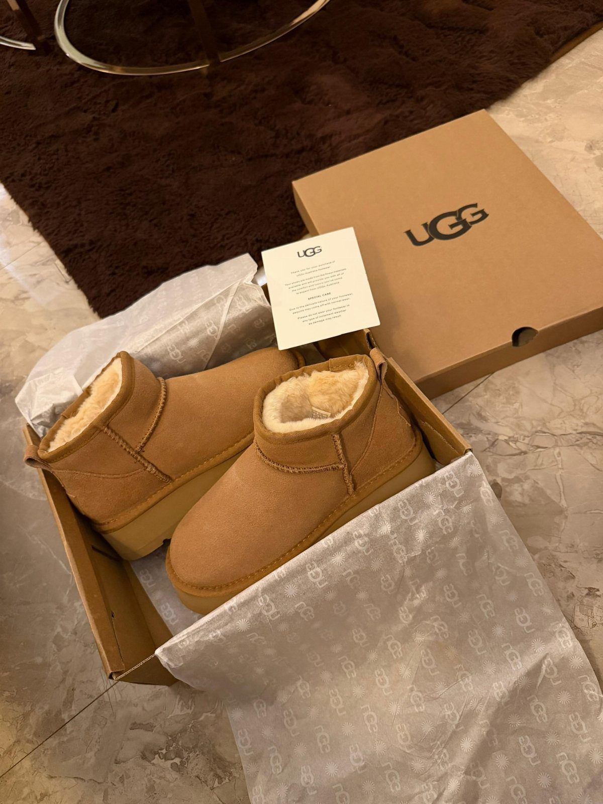 38 Gift Ideas for 13th Birthday in 2026, From Snoopy to LEGO 15 Tan UGG platform boots inside a shoebox with branded packaging on a marble floor.