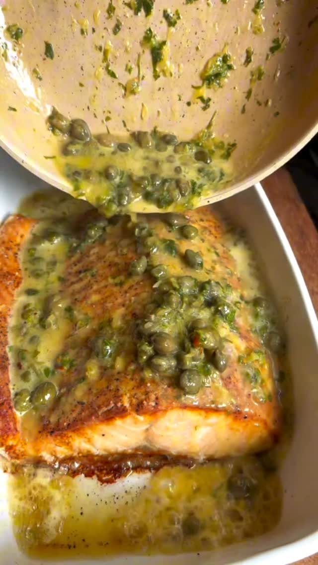 Cooked salmon fillet topped with a buttery olive and caper relish sauce.