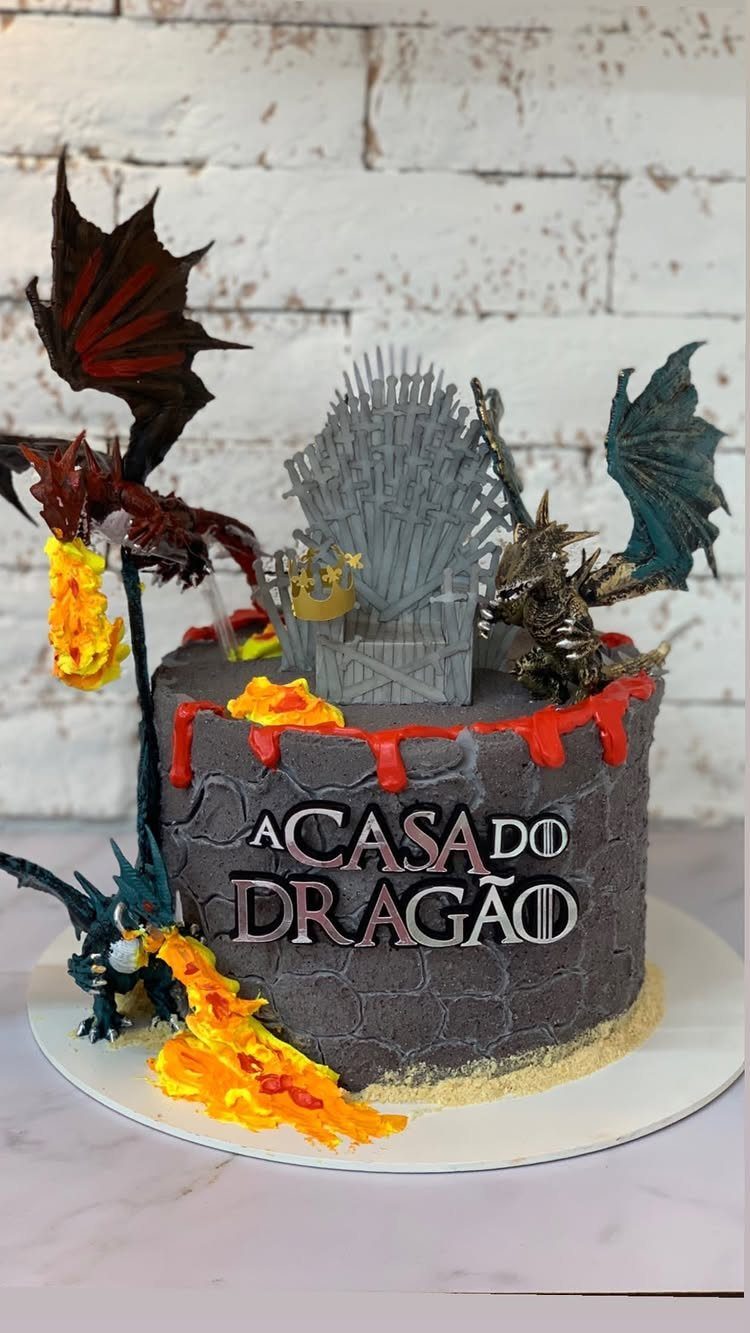 House of the Dragon cake with Iron Throne, dragons, and fire effects