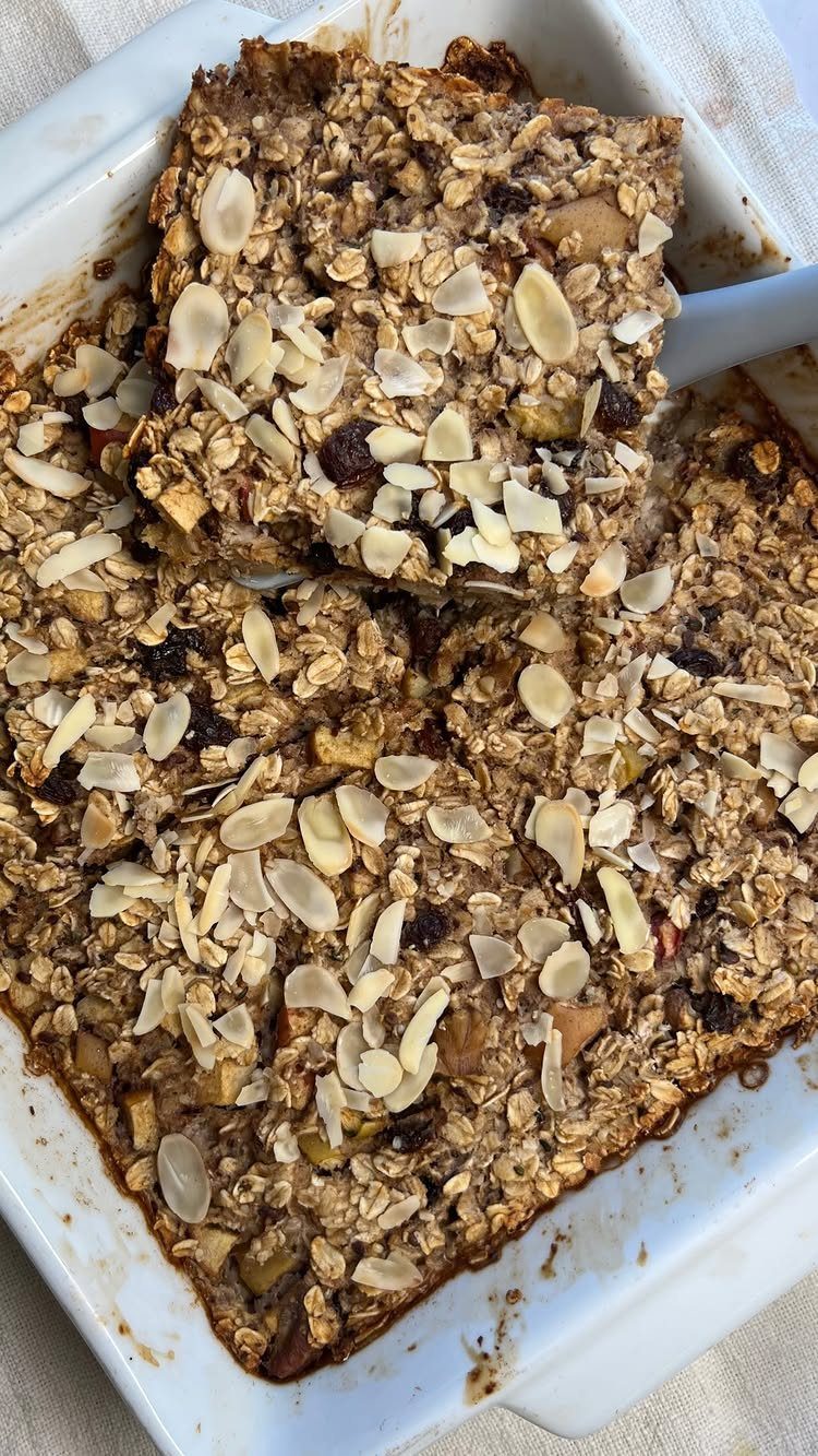 16 Morning Healthy Breakfast Ideas, From Egg Bites to Oats 9 Baked apple cinnamon oatmeal with sliced almonds in a white baking dish