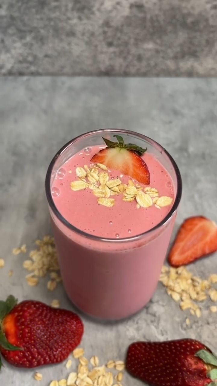 26 Oats Recipes for Snacks, from Energy Bites to Oat Crackers 25 Pink strawberry smoothie in a glass topped with rolled oats and fresh strawberry slices.