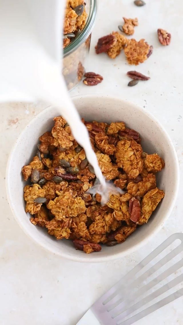 26 Oats Recipes for Snacks, from Energy Bites to Oat Crackers 3 Oat granola clusters with pecans and seeds in a bowl with pouring milk