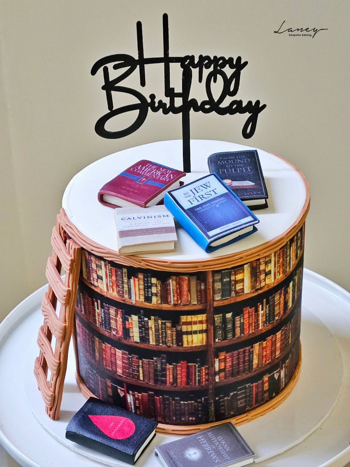 13 Open Book Cakes, from Fairytale Pages to Library Shelves 3 Round cake decorated as a library shelf with miniature books and birthday topper.