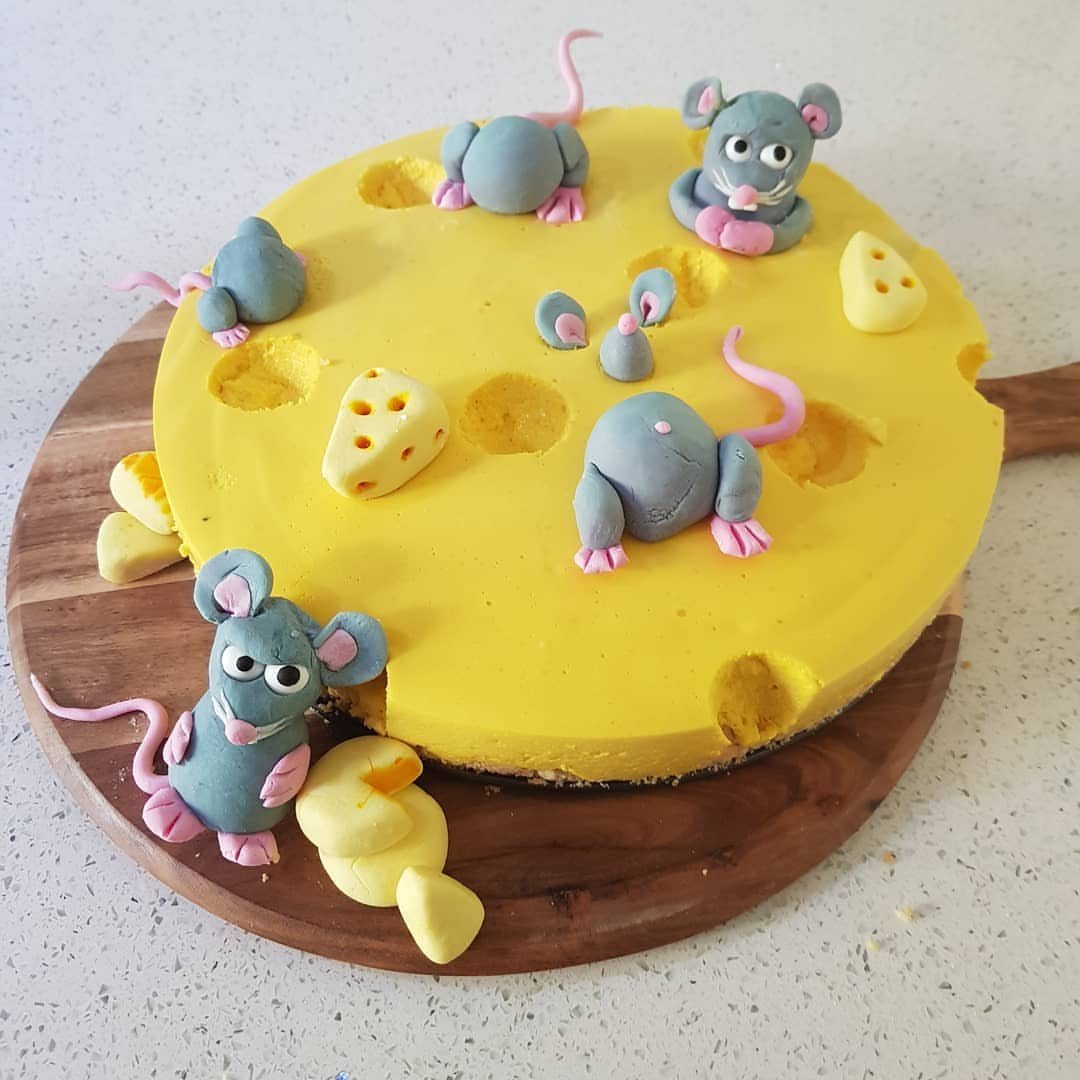 Rat Birthday Cake: 12 Ideas for Pet Rats, Pirates and Chefs 2 Yellow cheese wheel cake decorated with grey fondant rats and small cheese pieces.