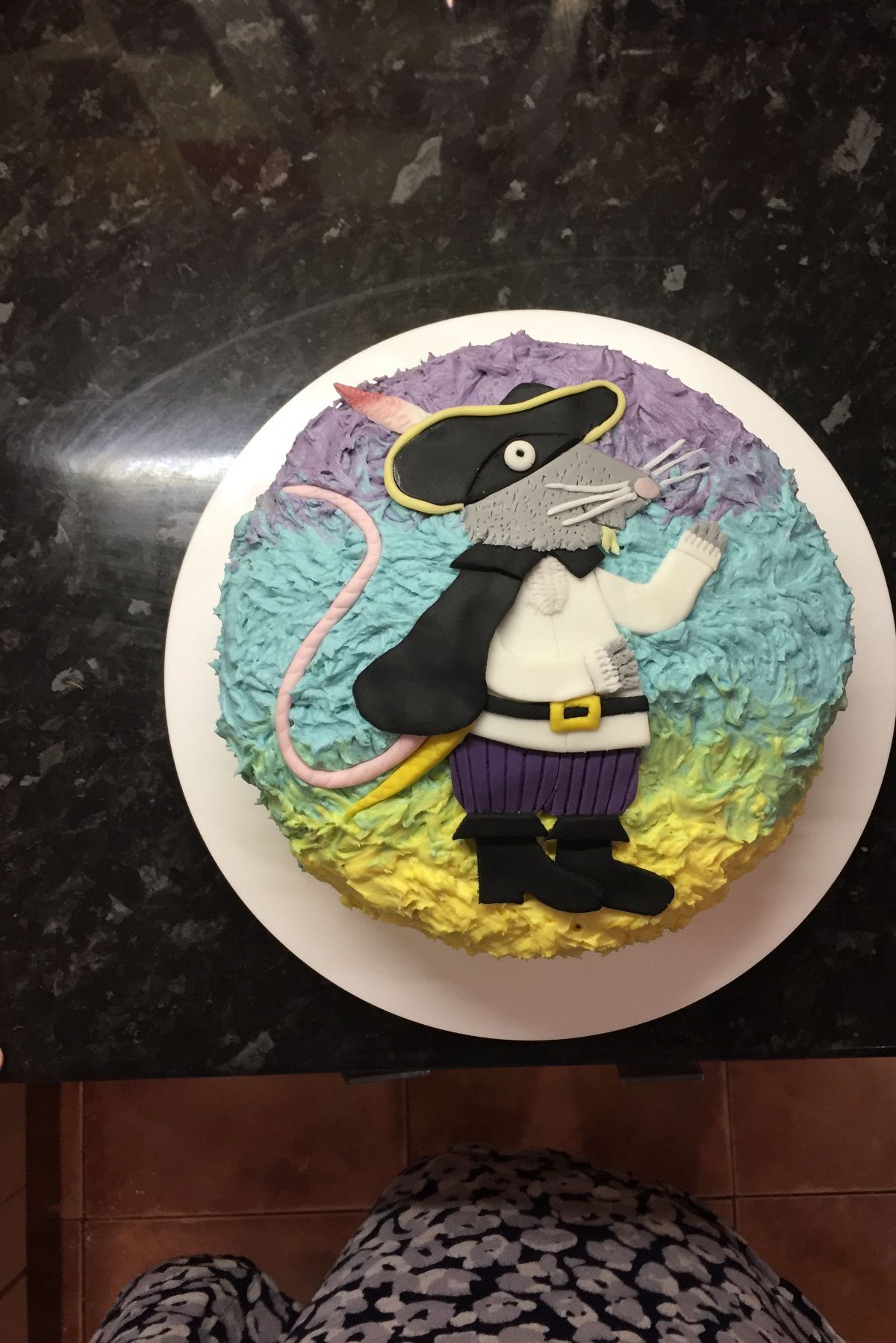 Rat Birthday Cake: 12 Ideas for Pet Rats, Pirates and Chefs 9 Pirate rat fondant decoration on a purple, blue, and yellow frosted birthday cake.
