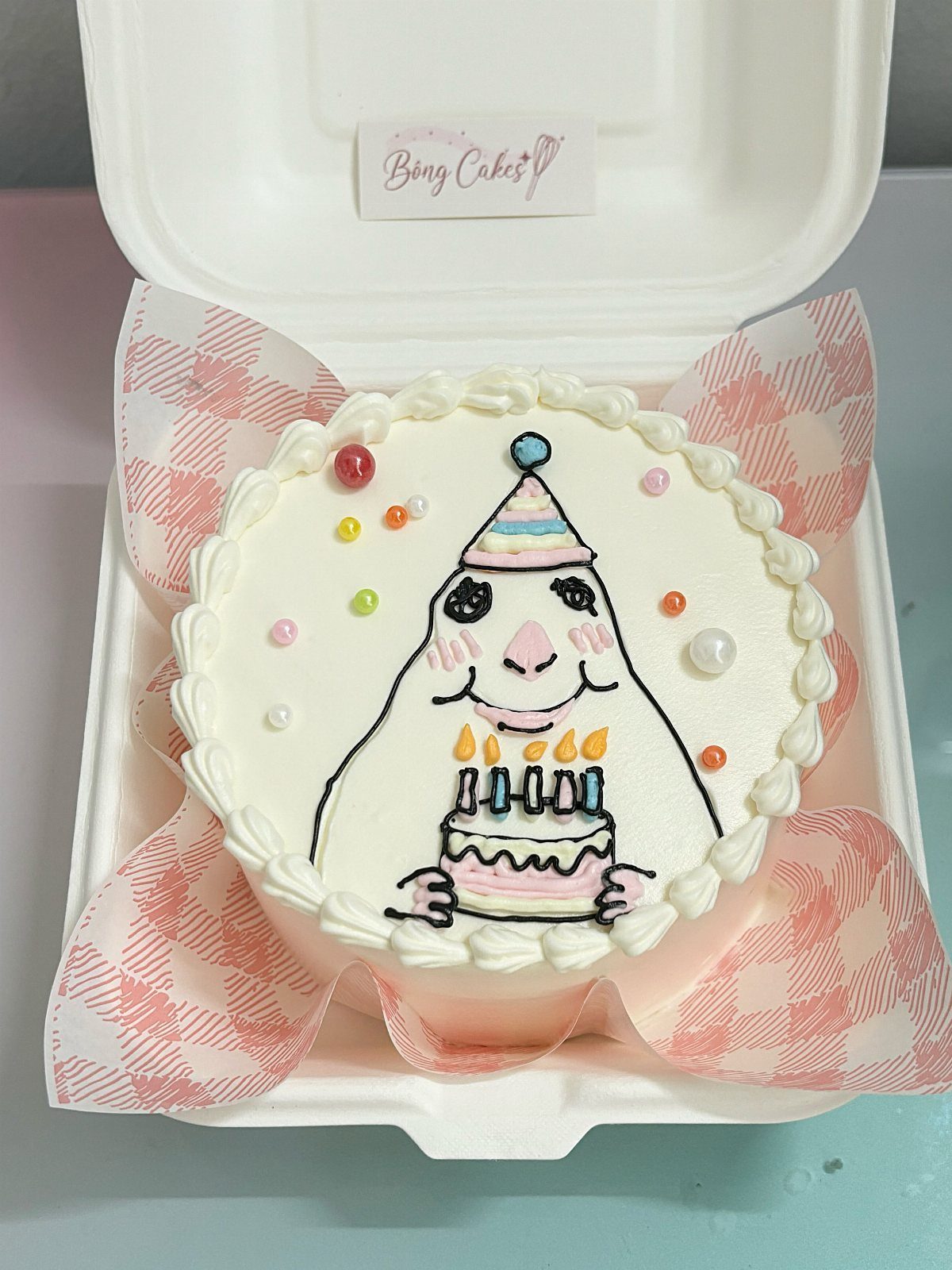 Rat Birthday Cake: 12 Ideas for Pet Rats, Pirates and Chefs 11 Small white bento cake with a drawing of a rat wearing a party hat.