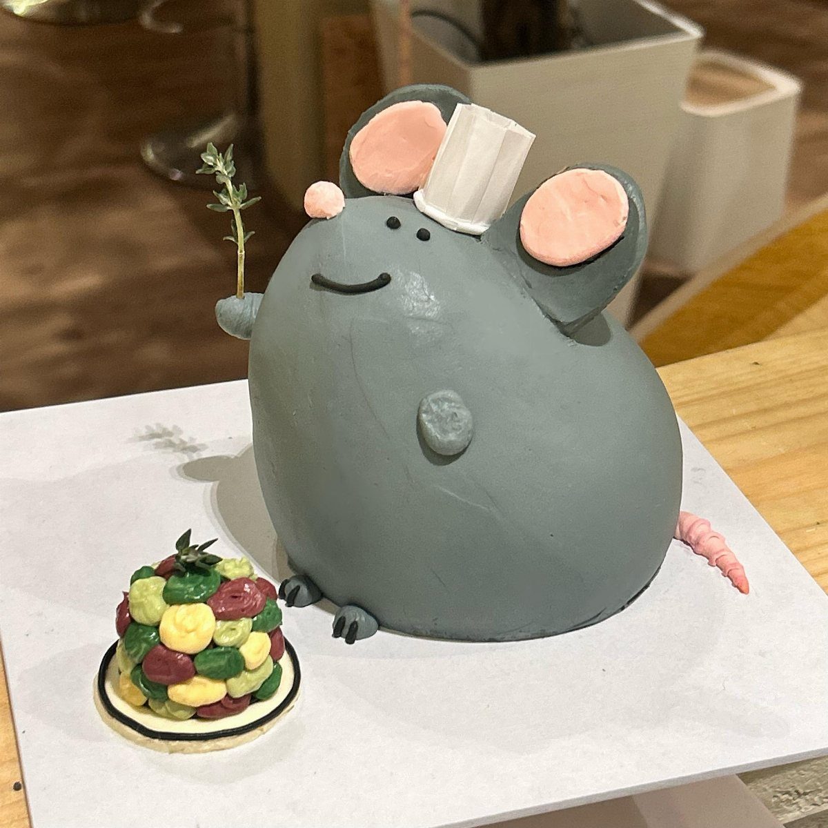 Rat Birthday Cake: 12 Ideas for Pet Rats, Pirates and Chefs 3 Grey rat-shaped cake with pink ears and a small pile of colorful candies.