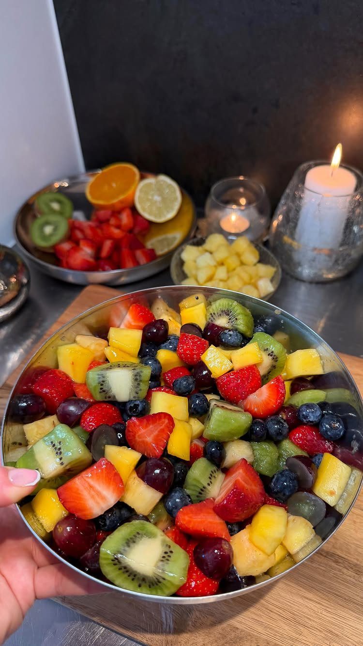 32 Ideas on What to Serve for Breakfast, From Eggs to Scones 21 Fresh fruit salad with strawberries, kiwi, pineapple, and blueberries in a metal bowl.